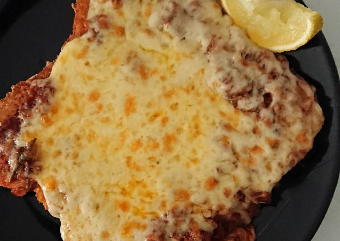 Chicken Snitz bolognese sauce melt with a zing