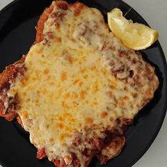 A picture of Chicken Snitz bolognese sauce melt with a zing.