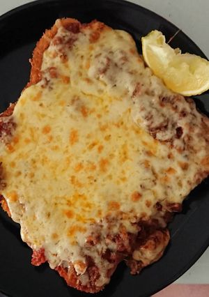 A picture of Chicken Snitz bolognese sauce melt with a zing.