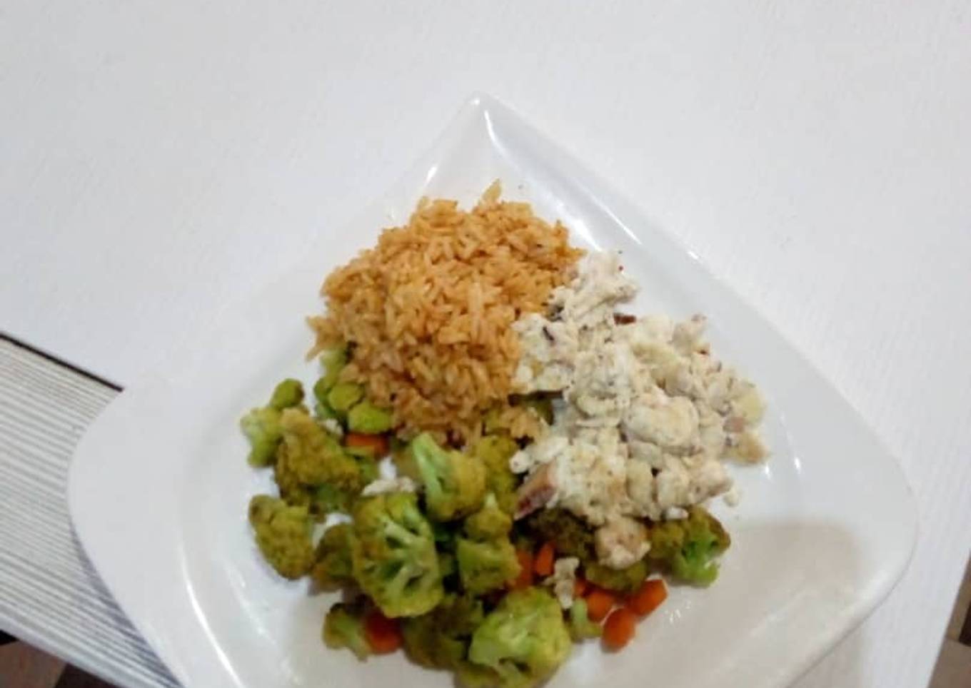 Stirred fry Broccoli with sadine and Jollof Rice
