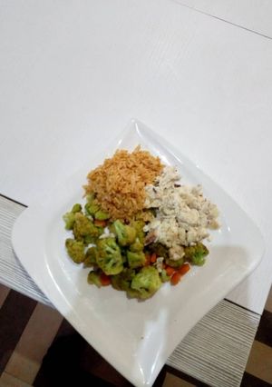 A picture of Stirred fry Broccoli with sadine and Jollof Rice.
