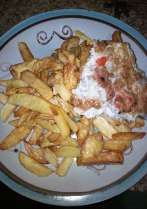 A picture of Fried potatoes and fried egg.