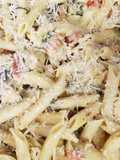 Chicken Bacon Pasta Spinach and Tomatos in garlic cream sauce