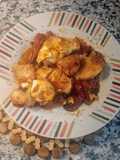 Medallones de merluza con pimientada y huevo poché