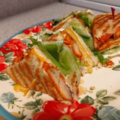 A picture of Tandoori chicken club sandwich.