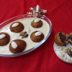 Chocolate_Stuffed_Khoya_gulabjamun_in_Malai_Rabadi A picture of Chocolate_Stuffed_Khoya_gulabjamun_in_Malai_Rabadi.
