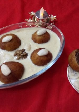 A picture of Chocolate_Stuffed_Khoya_gulabjamun_in_Malai_Rabadi.