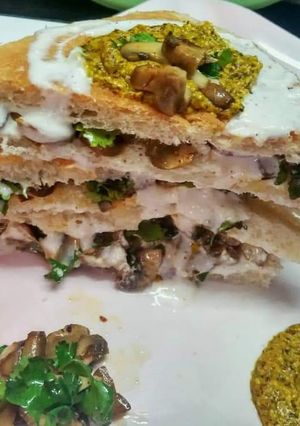 A picture of Mushroom sandwich with mustard sauce.