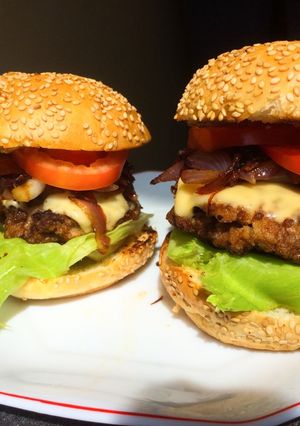 A picture of Juicy homemade burgers-with caramelized onions.