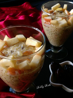 A picture of Dates raisins sabudana kheer served with chunk apples.