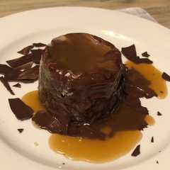 A picture of Molten Lava Cake with Salted Caramel Sauce.