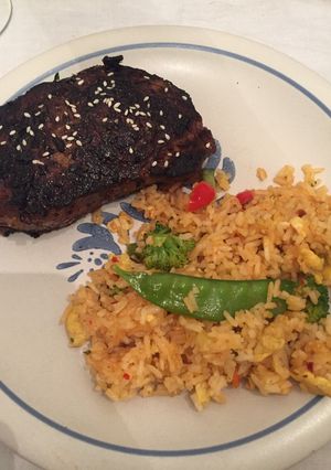 A picture of Asian Sirloin Steak with Thai Drunken Fried Rice.