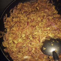 A picture of Scrambled eggs with stir-fry onions.