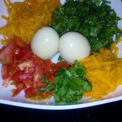 A picture of My breakfast salad plus eggs.