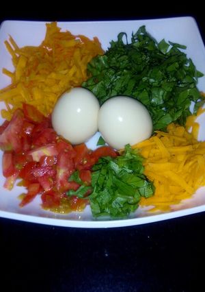 A picture of My breakfast salad plus eggs.