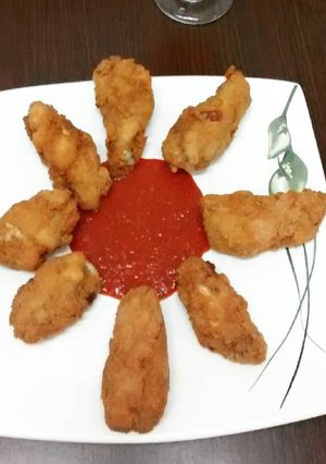 Una foto de Chicken wings con salsa picante