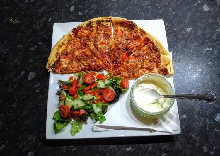 Home made pizza with garlic dip