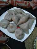 আতপ চালে নারকেল চিনি দিয়ে মেরা পিঠা