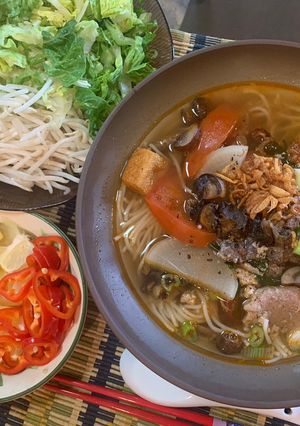 A picture of Bún Riêu Ốc (Vietnamese Snail and Crab Noodle Soup).