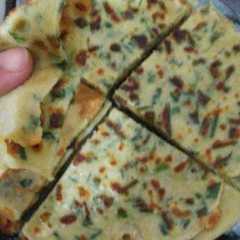 Una foto de Tortilla finita de cebolla de verdeo, tipo panqueque