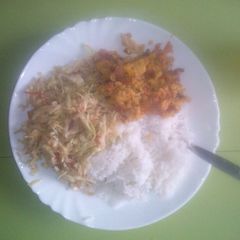 A picture of Fried cabbage with rice and eggs.