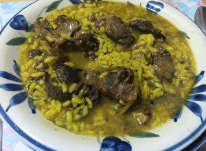 Foto principal de Arroz caldoso con conejo de campo