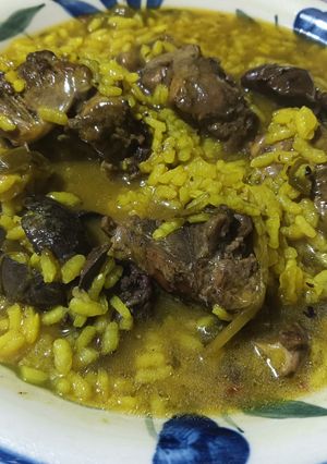Una foto de Arroz caldoso con conejo de campo