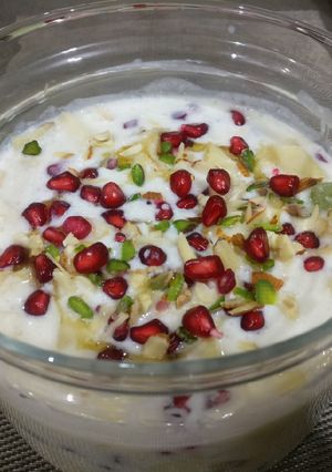 A picture of Fruits Raita with curd and milkmaid.