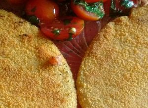 Una foto de Mila de soja saborizada con jamón y tomatitos Cherry c/albahaca