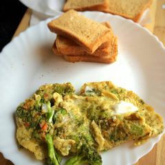 A picture of Broccoli,Dill and Feta Omelette with Toast.