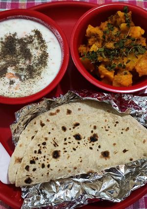 A picture of Masala aalu,cucumber carrot raita with plain roti (simple Lunch).