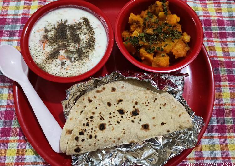 Masala aalu,cucumber carrot raita with plain roti (simple Lunch)