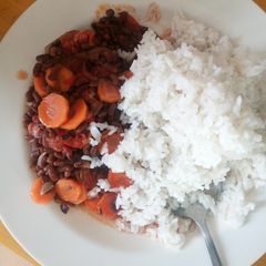 A picture of Boiled rice and fried green grams(ndengu).