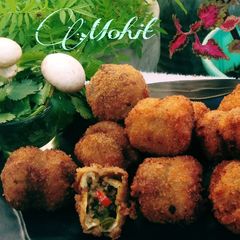 A picture of Cheese stuffed mushrooms.
