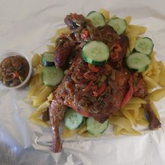 A picture of Roasted chicken and chips.