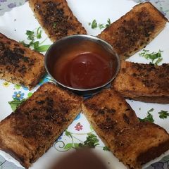 A picture of Garlic Brown Bread with peri peri masala Dominos style sticks.