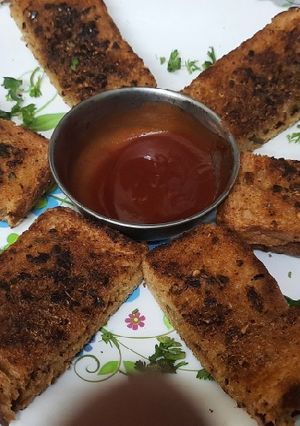 A picture of Garlic Brown Bread with peri peri masala Dominos style sticks.