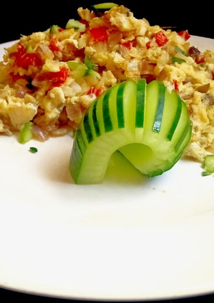 A picture of Scrambled egg with Cucumber.