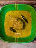 Shorshe Ilish (Hilsa Fish cooked in mustard gravy)