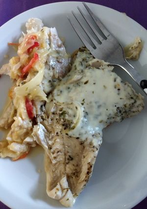 Una foto de Filet de merluza con queso