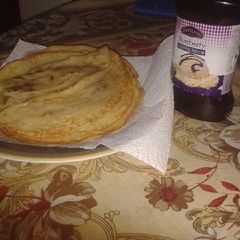 A picture of Pancake with blueberry sauce.