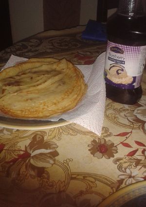 A picture of Pancake with blueberry sauce.