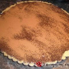 A picture of Chocolate tart with leftover kourabiedes.