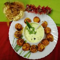 A picture of Curd appe with curd chutney.