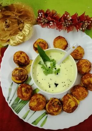 A picture of Curd appe with curd chutney.