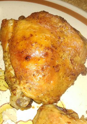A picture of Roasted chicken thighs skin-on .