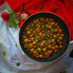 A picture of Baby Potato Curry with Green Peas.