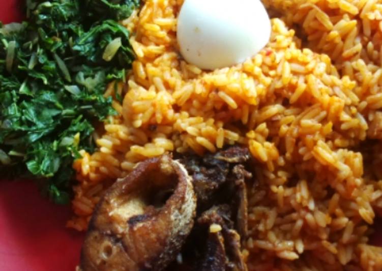 Jollof rice with fried crocker fish and vegetable