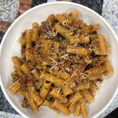 A picture of Rigatoni pasta in minced meat.