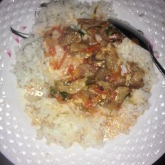 A picture of Beef stew and Rice.
